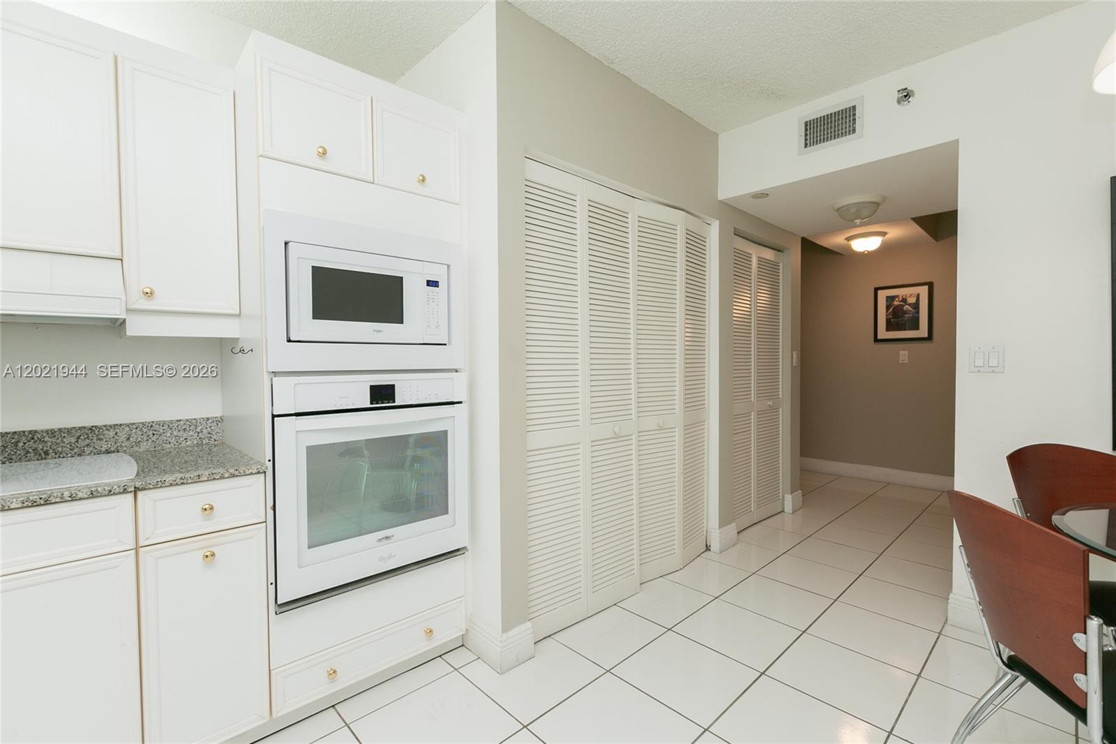 Photo of 8855 Collins Ave  #6F, Surfside, Florida, 33154 - Laundry behind the folding doors