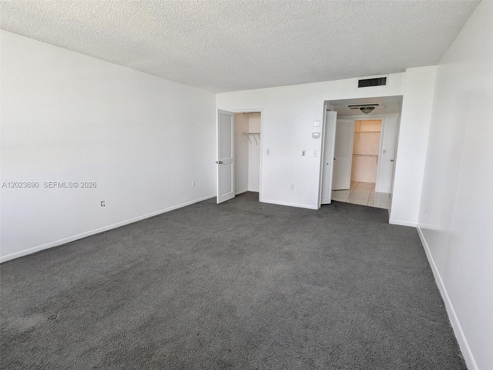 Photo of 9801 Collins Ave  #11M, Bal Harbour, Florida, 33154 - Master Bedroom in-suite with 3 closets