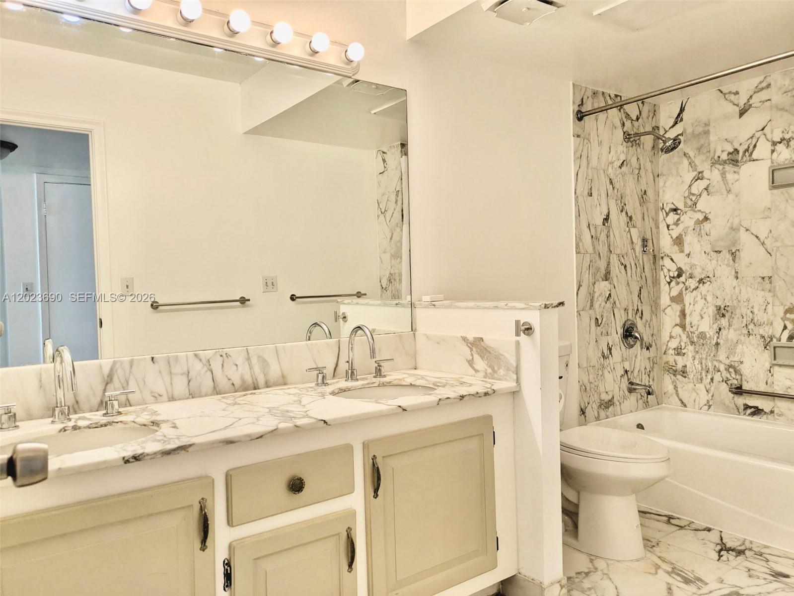 Photo of 9801 Collins Ave  #11M, Bal Harbour, Florida, 33154 - Master Bathroom 2 sinks, a shower with bathtub