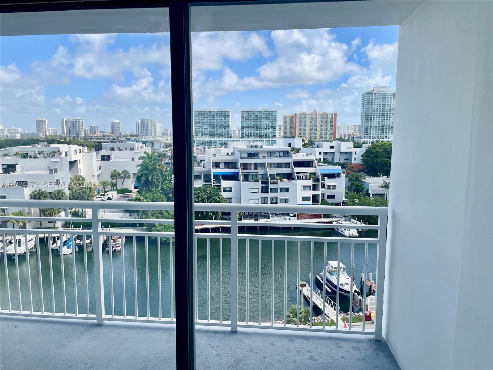 Photo of 400 Kings Point Dr  #829, Sunny Isles Beach, Florida, 33160 - Living Room and Balcony