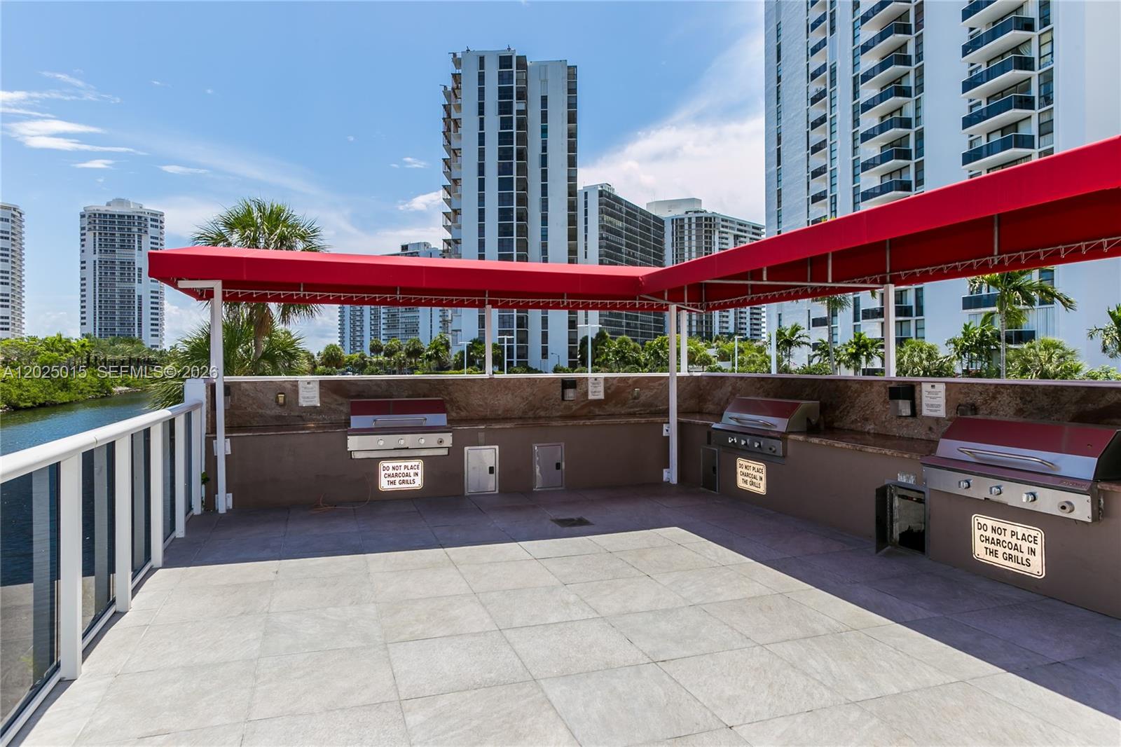 Photo of 3625 Country Club Dr  #402, Aventura, Florida, 33180 - Barbecue area overlooking the canal.