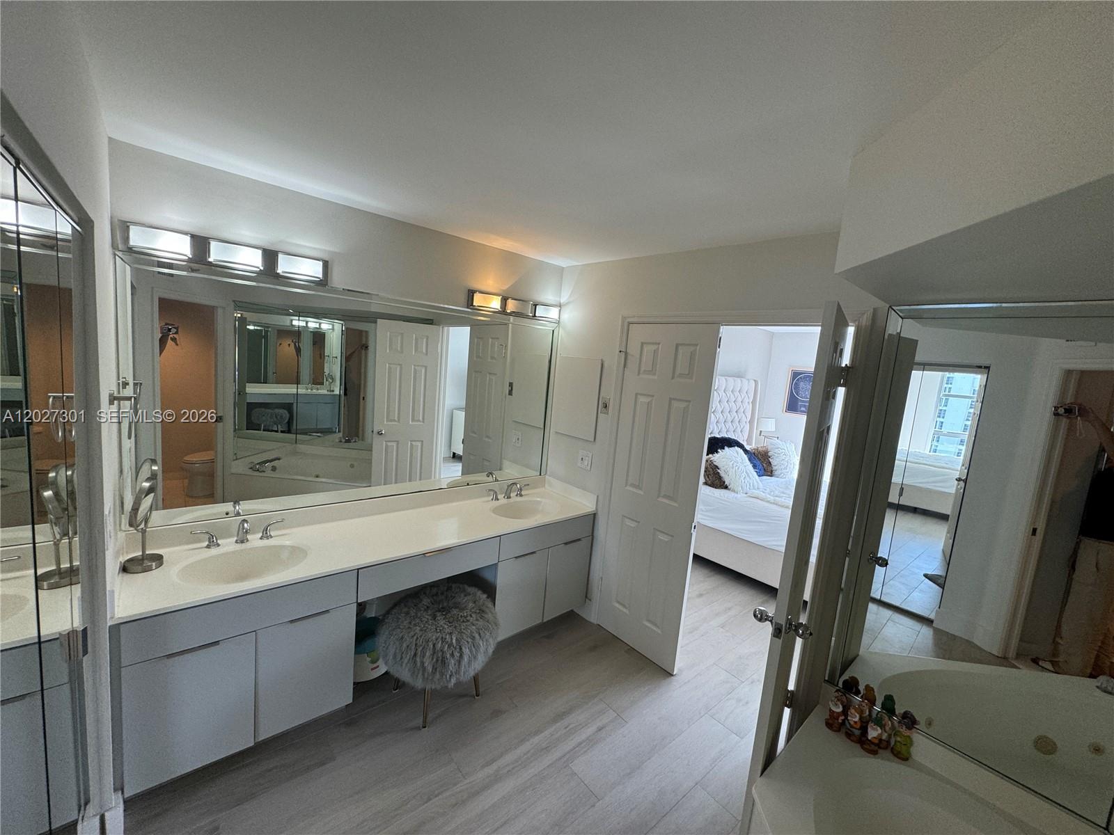 Photo of 3500 Mystic Pointe Dr #2003, Aventura, Florida, 33180 - Master bathroom with private toilet / shower area. Separate Tub / Shower.