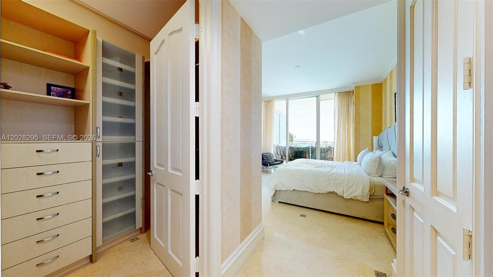 Photo of 10295 Collins Ave #205, Bal Harbour, Florida, 33154 - Primary bedroom entry with walk-in closet