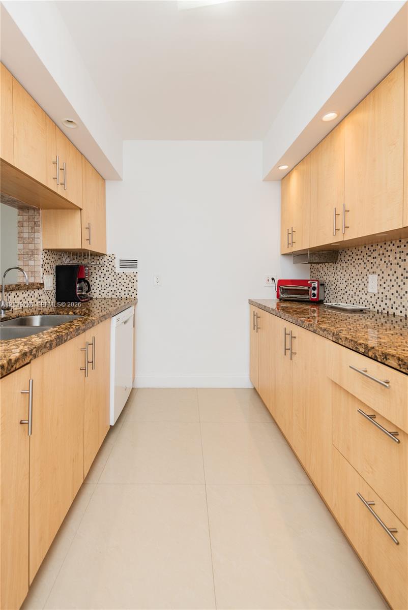 Photo of 3505 Ocean Dr  #221, Hollywood, Florida, 33019 - Kitchen with Granite Counter Tops