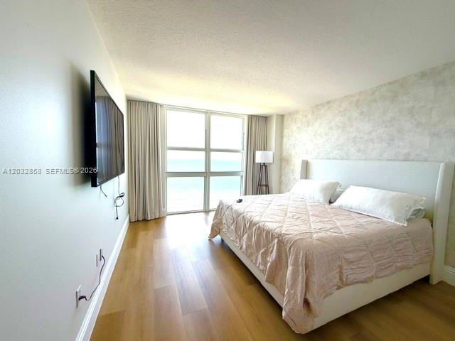 Photo of 2080 Ocean Dr #1512, Hallandale Beach, Florida, 33009 - Primary Bedroom with floor to ceiling views of the ocean