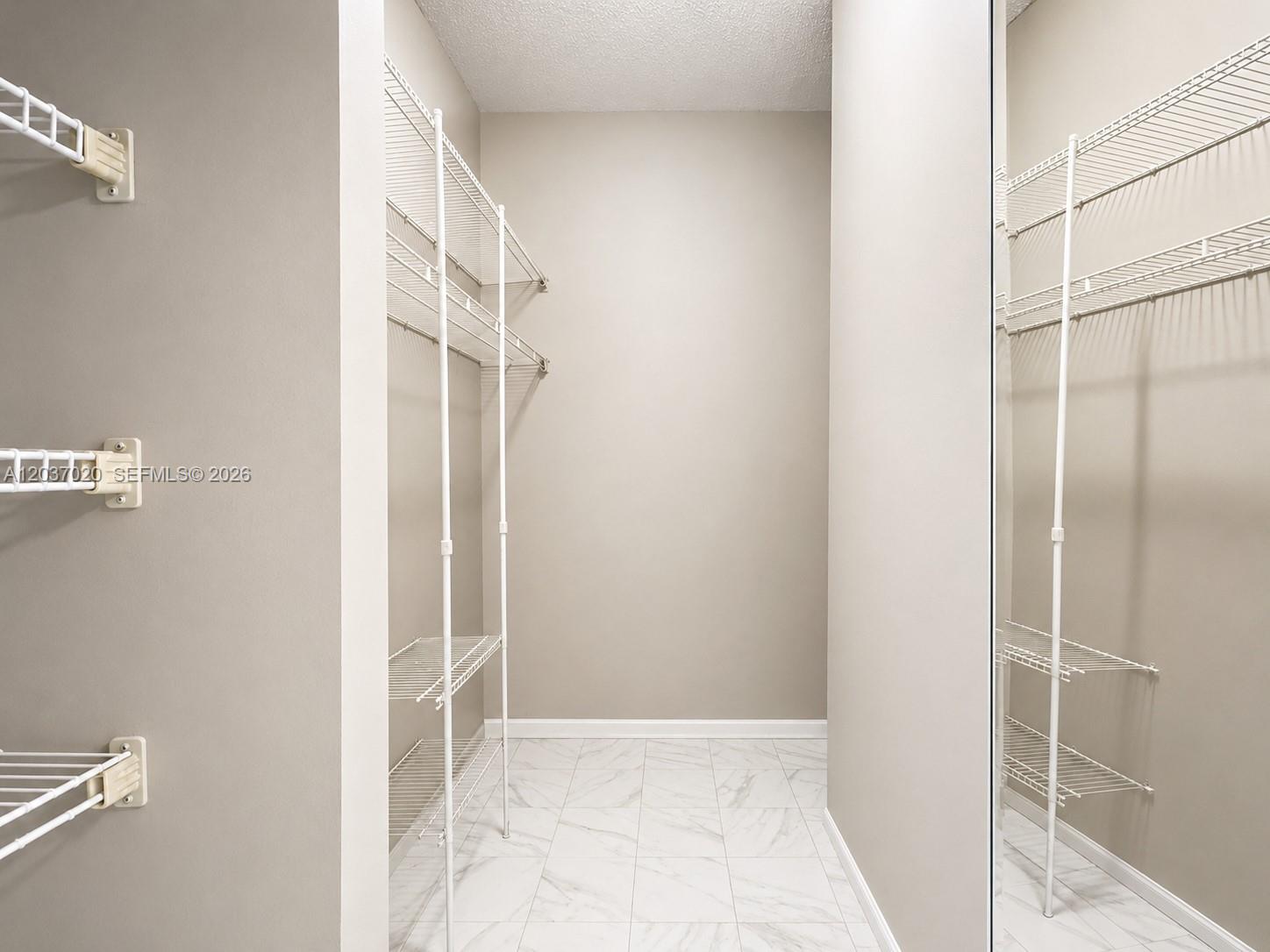 Photo of 20505 Country Club Dr  #138, Aventura, Florida, 33180 - Primary Bedroom Walk-In Closet
