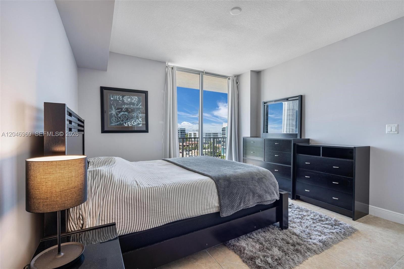 Photo of 140 Dixie Hwy #609, Hollywood, Florida, 33020 - PRIMARY BEDROOM has walk in closet, en suite bathroom with shower/tub combo and its own exit to balcony
