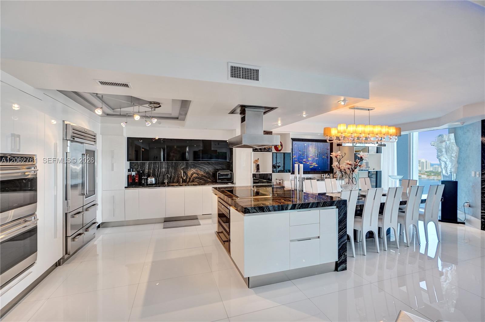 Photo of 3201 183rd St  #2403, Aventura, Florida, 33160 - Kitchen and dinning table for 12.