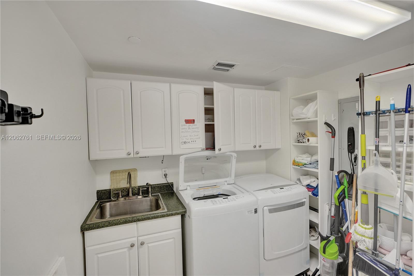 Photo of 3201 183rd St  #2403, Aventura, Florida, 33160 - There is a full bathroom in the laundry.