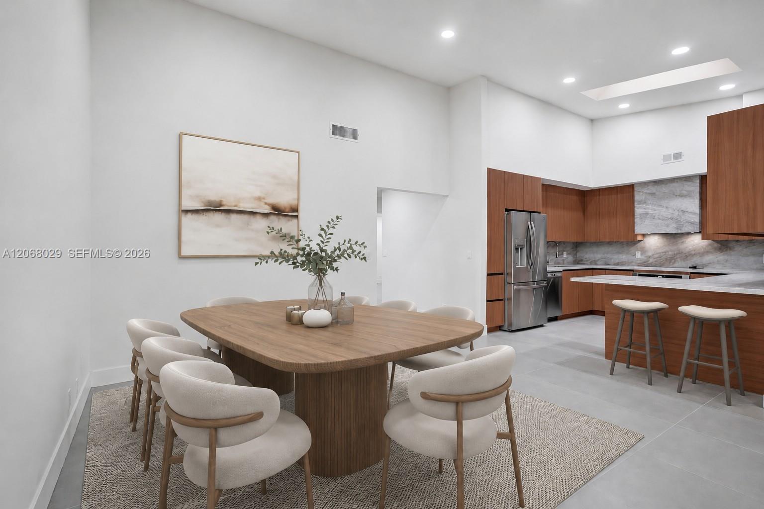 Closer view of the dining room off the kitchen. Virtually staged.