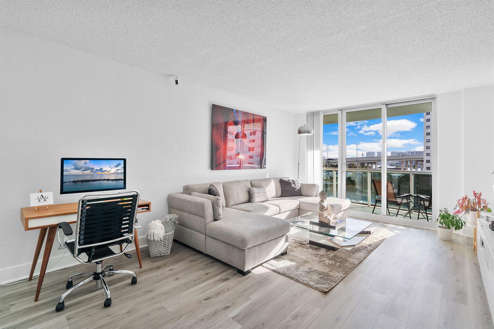 Photo of 19380 Collins  #523, Sunny Isles Beach, Florida, 33160 - Living – sofa & workspace