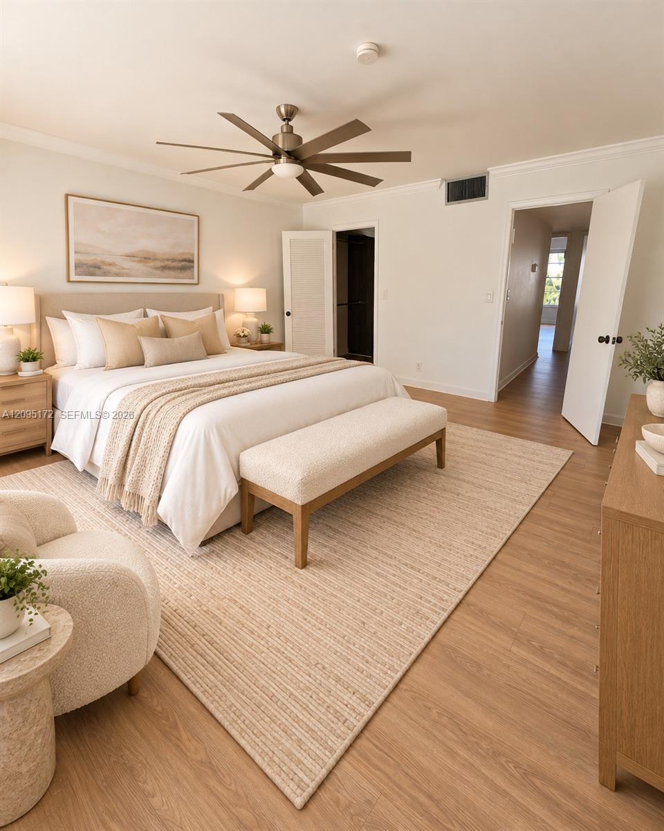 Open-concept area featuring wood-finish flooring, recessed lighting, a staircase with metal railings, and a pass-through wall cutout