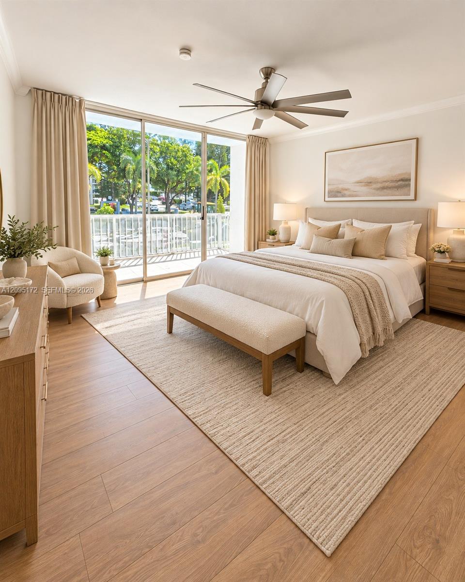 Open-concept space featuring wood-finish flooring, sliding glass patio doors, recessed track lighting, and window security bars