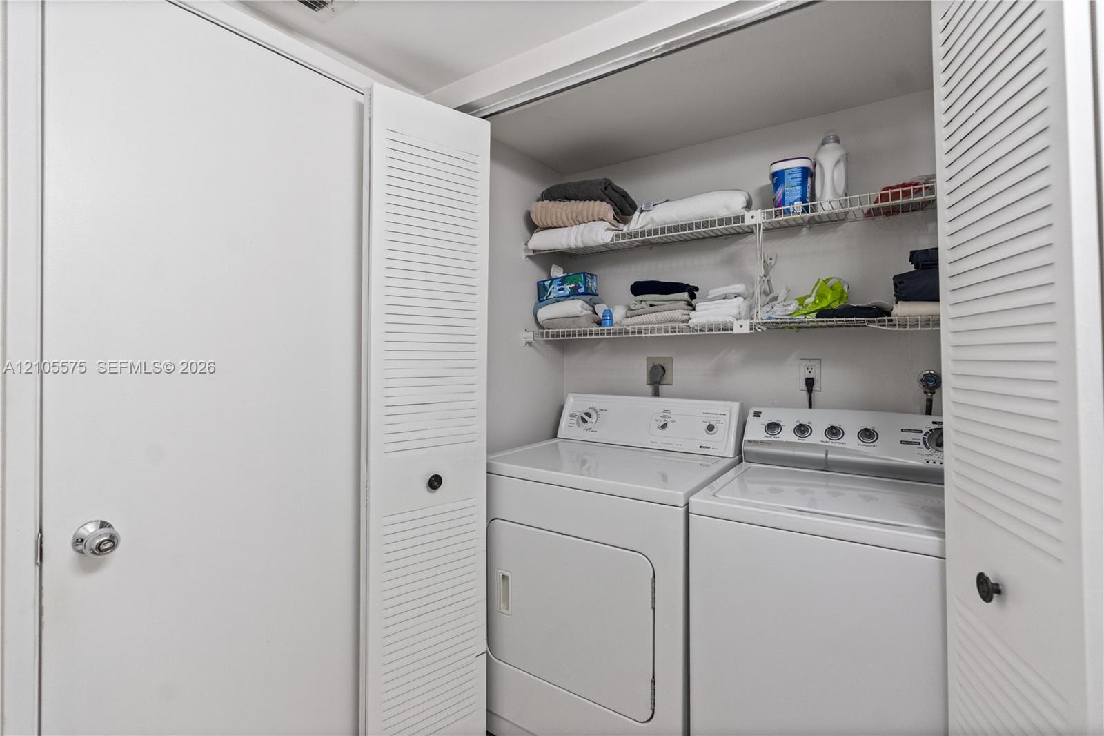 Convenient guest powder room and in-unit washer and dryer, providing everyday comfort and functionality at Mystic Pointe in Aventura.