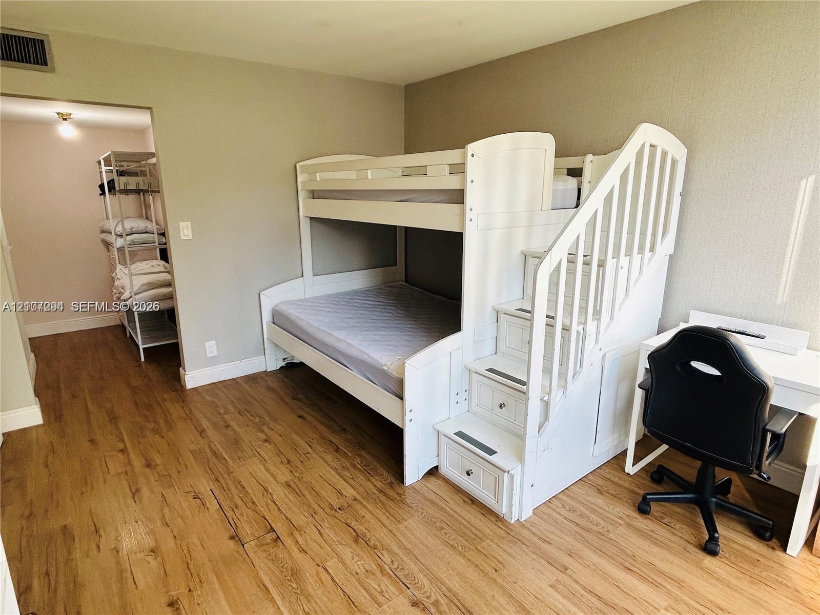 Neutral-toned walls and wood-finish flooring