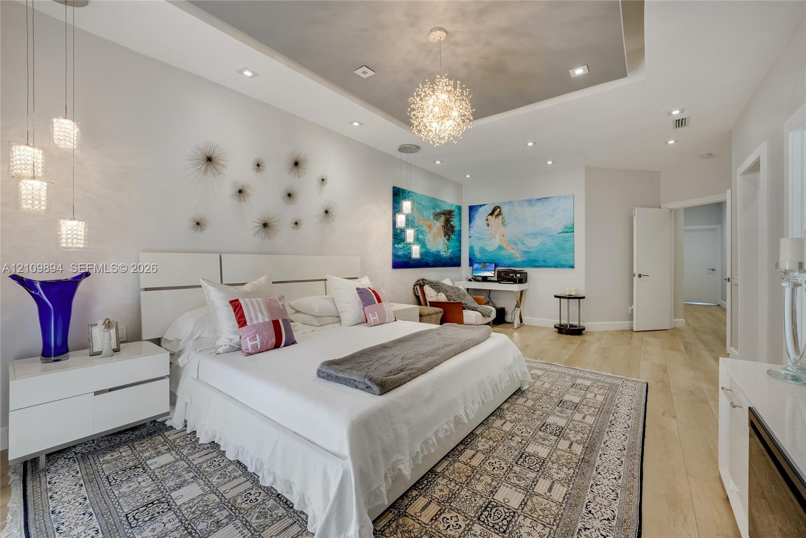 Living area featuring recessed lighting, a built-in linear fireplace with surround shelving, tile-finish flooring, and a staircase with glass railings and decorative stone-tile treads