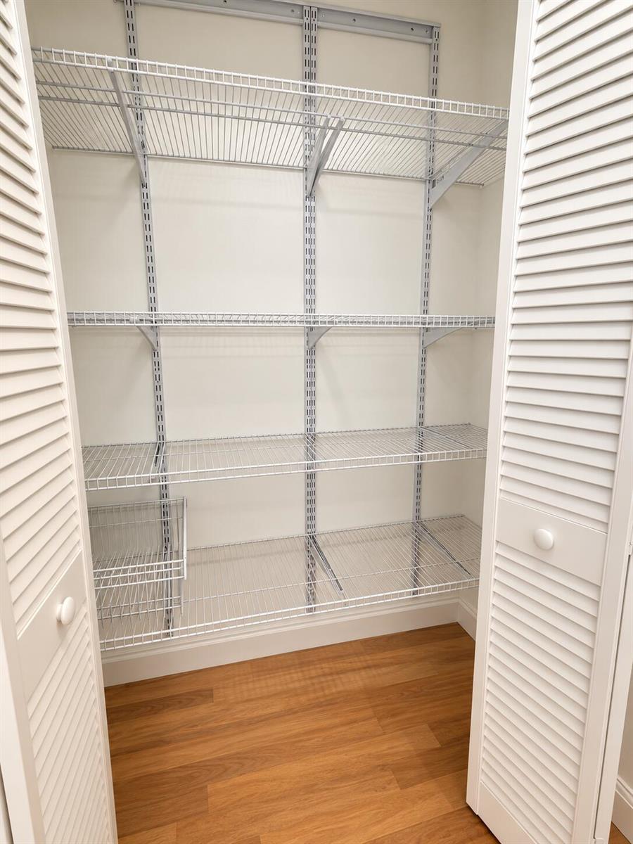 Empty White Wire-Shelved Closet